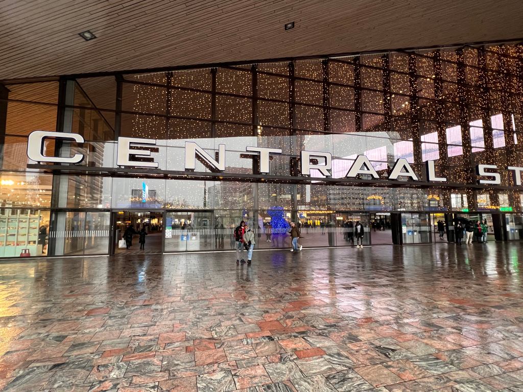 Shalvah and I standing in front of Rotterdam Centraal Station